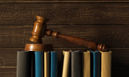 Law students studying legal principles and case analysis for the OTHM Level 5 Extended Diploma in Law in a professional academic environment.